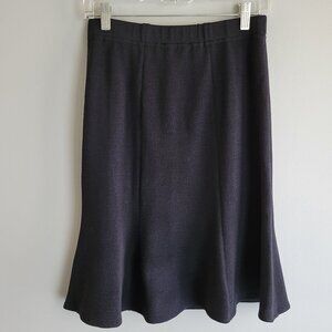 New with tags St. John black flare skirt originally purchased at Neiman Marcus.